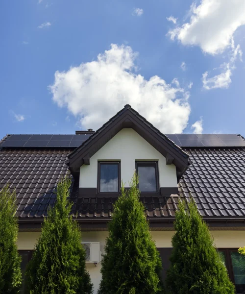 suburban-home-exterior-with-blue-sky-and-clouds-2026-03-18-04-26-17-utc